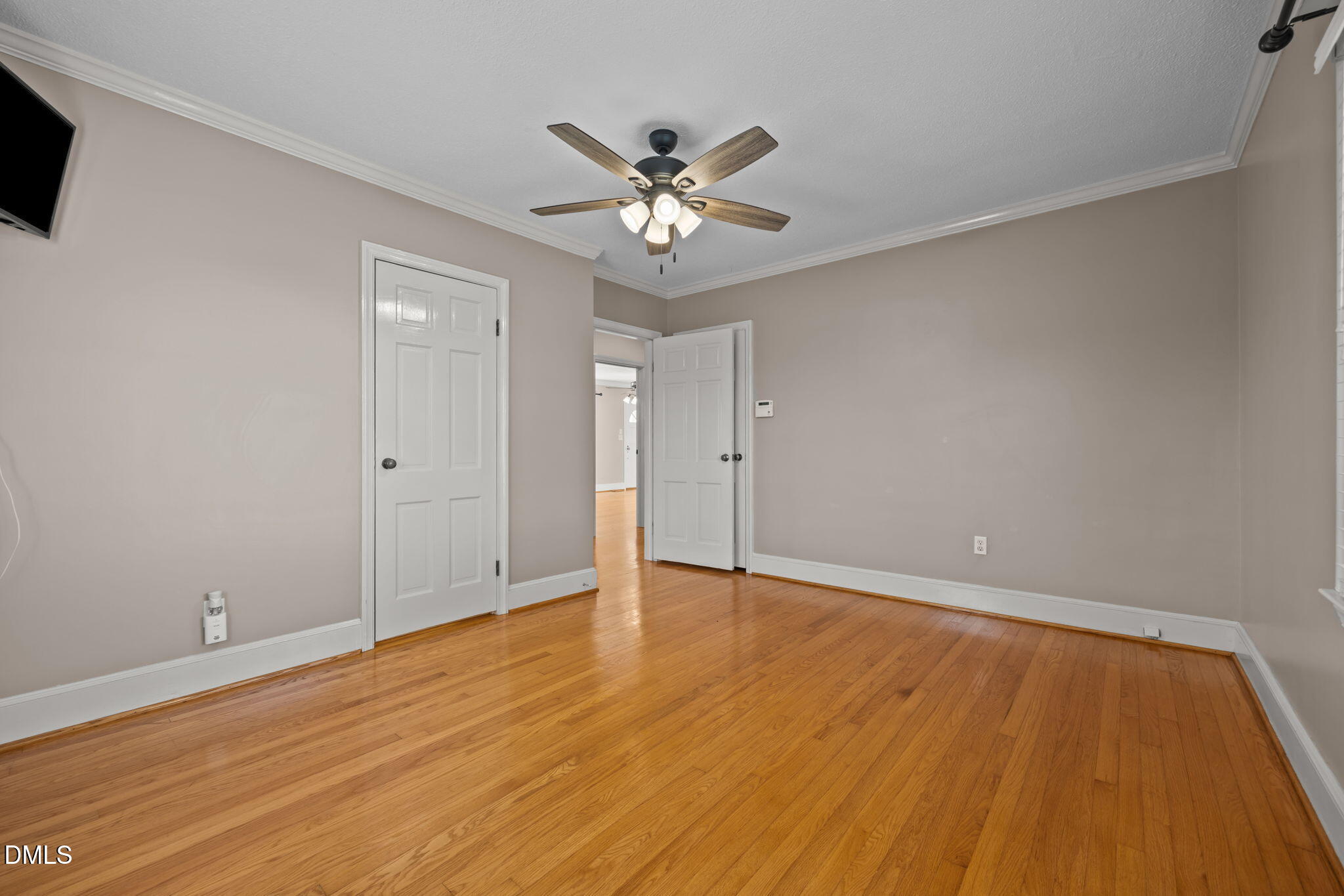 7111 Highway 401 Bunnlevel, NC 28323 - Photo 17 of 39 a view of an empty room with window and wooden floor