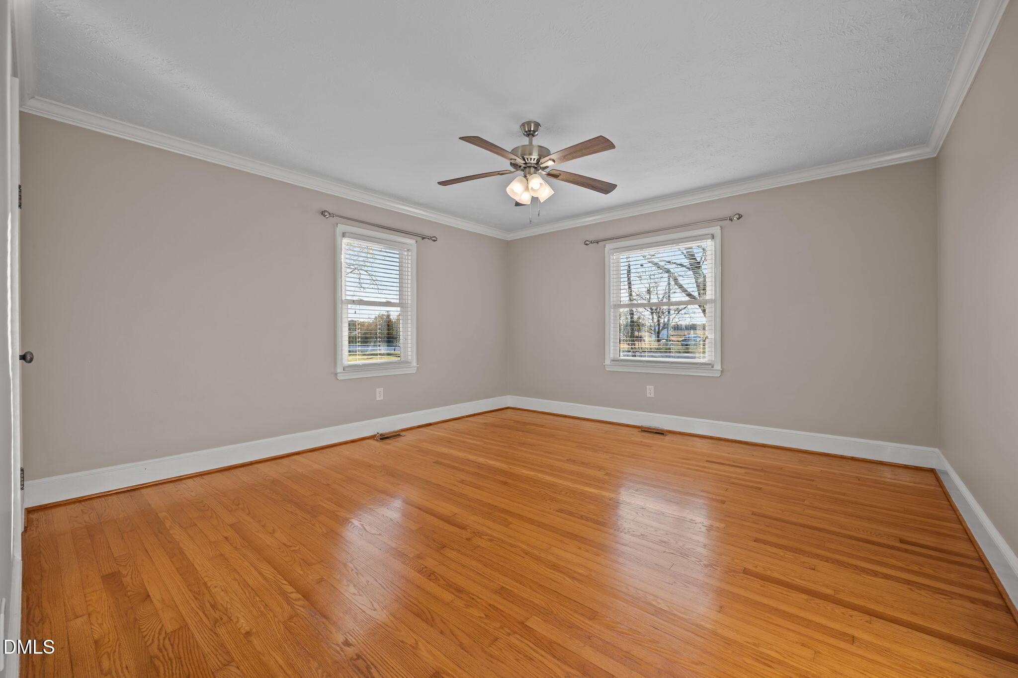 7111 Highway 401 Bunnlevel, NC 28323 - Photo 19 of 39 a view of an empty room with a window and wooden floor