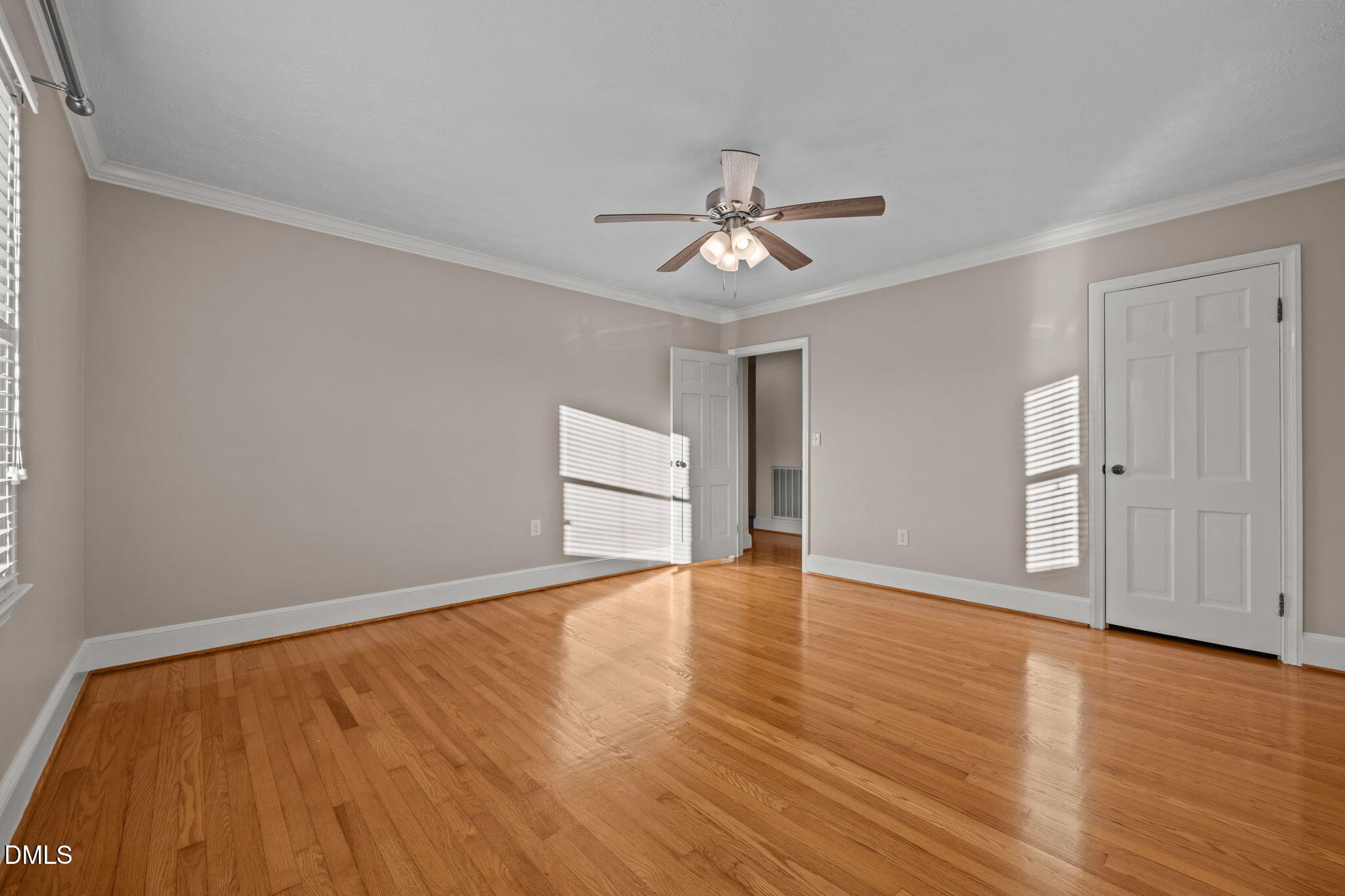 7111 Highway 401 Bunnlevel, NC 28323 - Photo 20 of 39 a view of empty room with wooden floor and ceiling fan