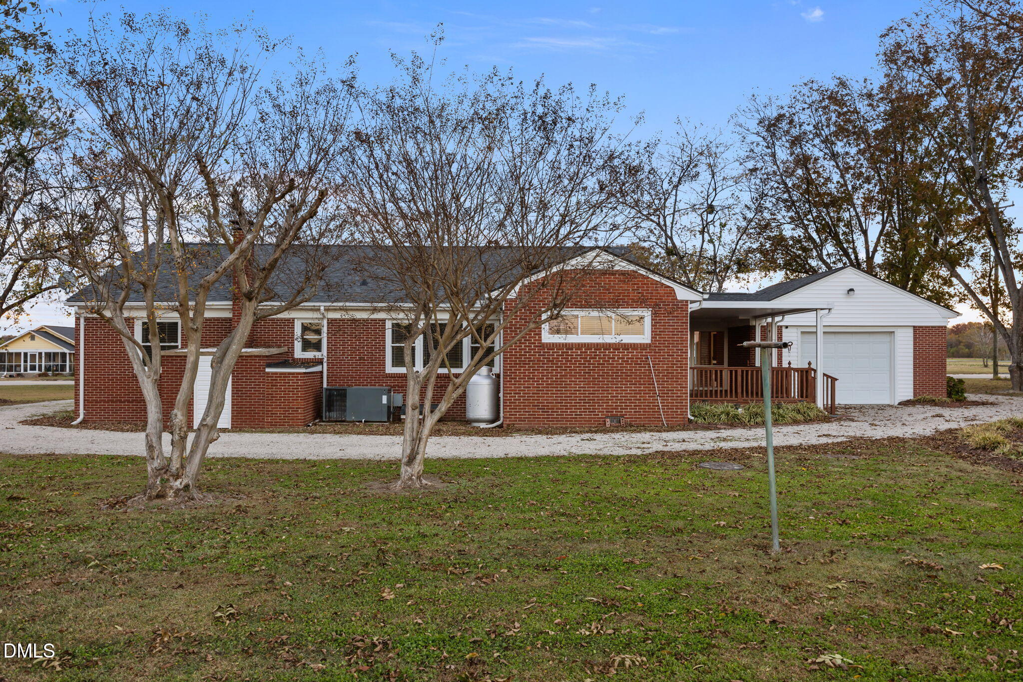 7111 Highway 401 Bunnlevel, NC 28323 - Photo 24 of 39 a house that has a tree in front of it