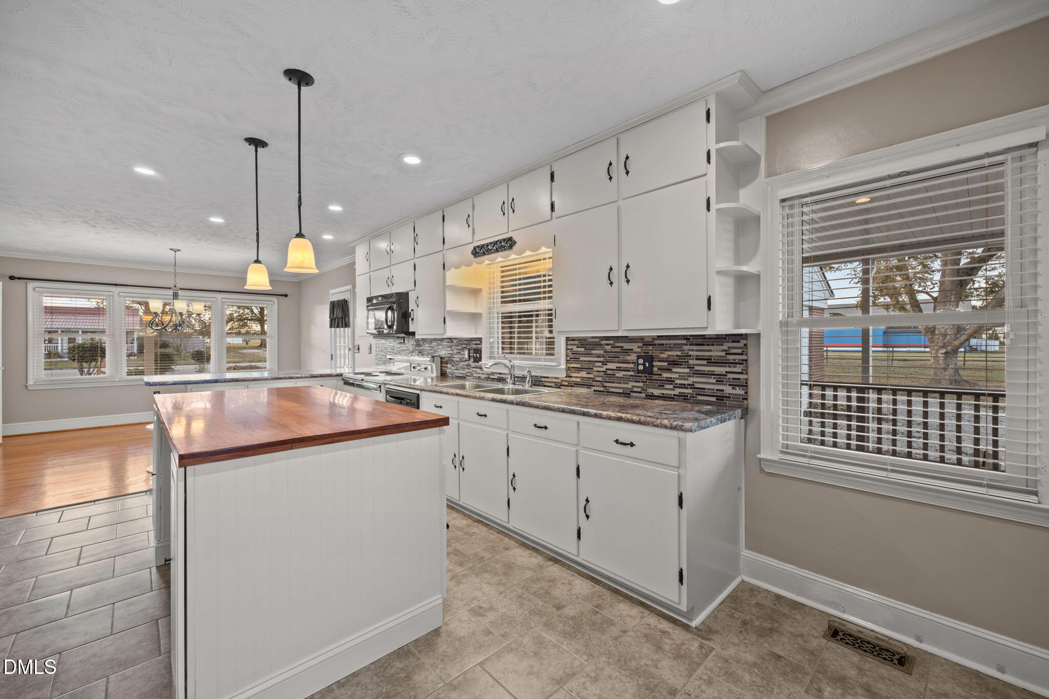 7111 Highway 401 Bunnlevel, NC 28323 - Photo 4 of 39 a kitchen with stainless steel appliances granite countertop a stove a sink and a refrigerator