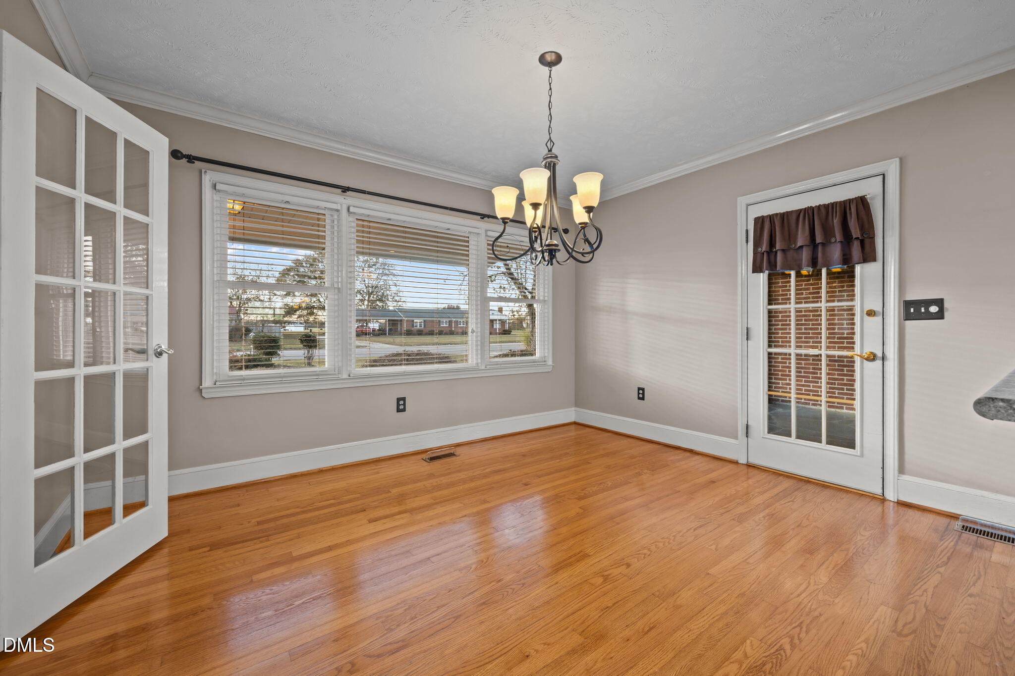 7111 Highway 401 Bunnlevel, NC 28323 - Photo 10 of 39 a view of an empty room with wooden floor and a window