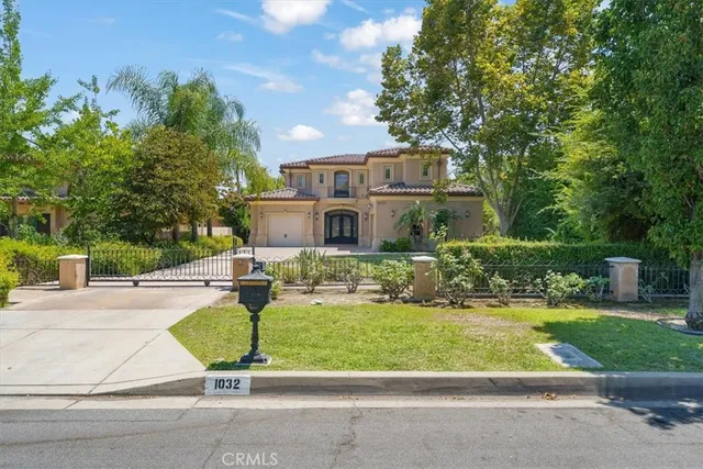 a house view with a seating space and garden