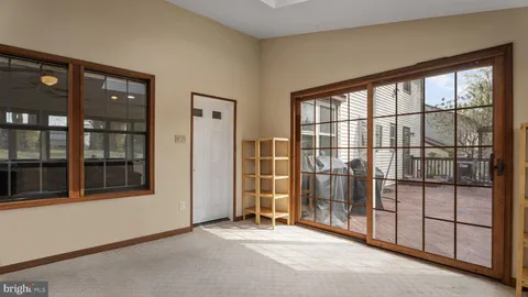 a view of empty room with windows