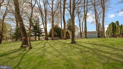 a view of outdoor space with deck and trees