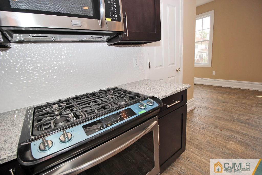 1035 New Durham Road Edison, NJ 08817 - Photo 14 of 24 a close view of stove top oven