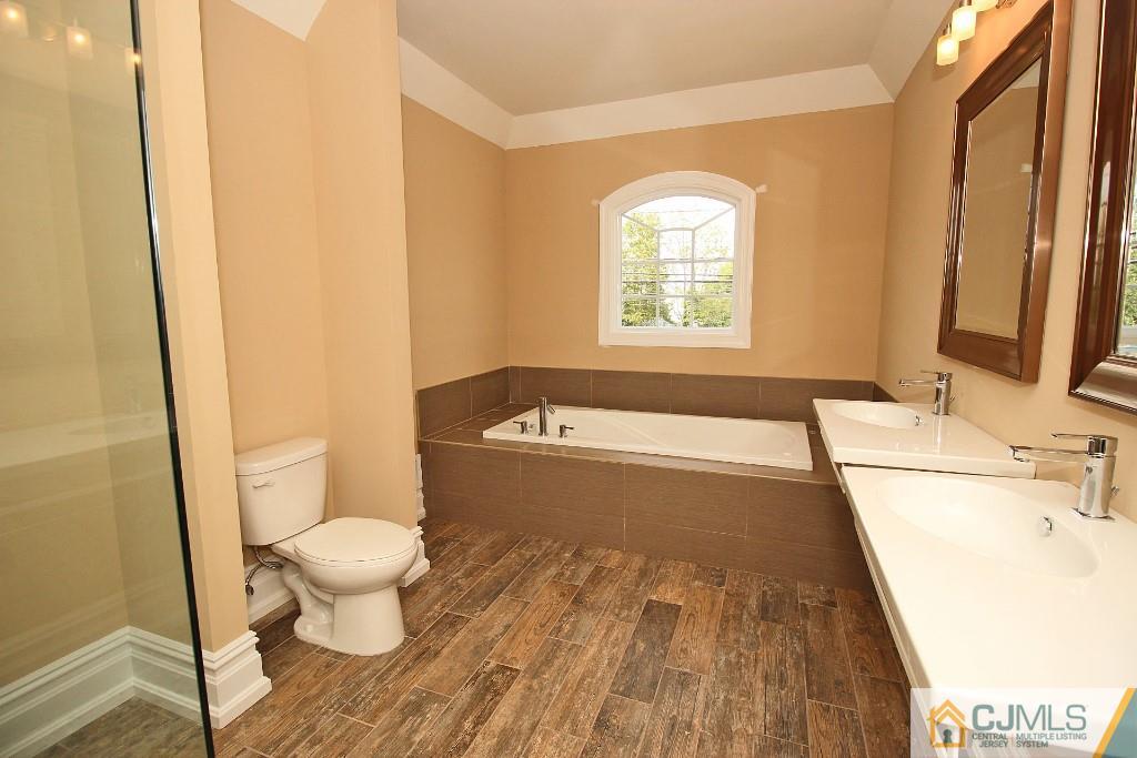 1035 New Durham Road Edison, NJ 08817 - Photo 17 of 24 a bathroom with a sink and a bathtub