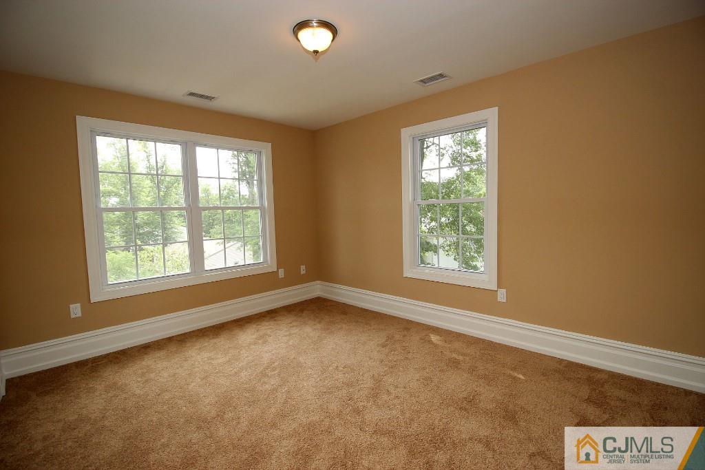 1035 New Durham Road Edison, NJ 08817 - Photo 5 of 24 a view of an empty room with a window
