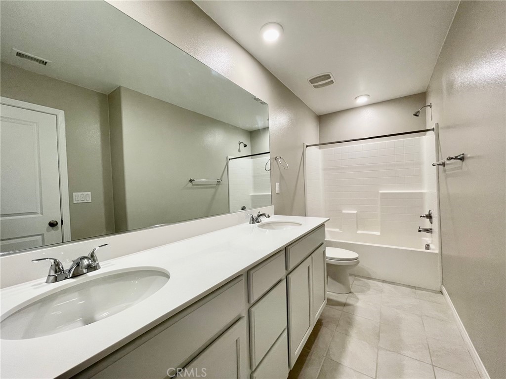 164 Spectacle Irvine, CA 92618 - Photo 15 of 21 a bathroom with a sink a toilet and shower