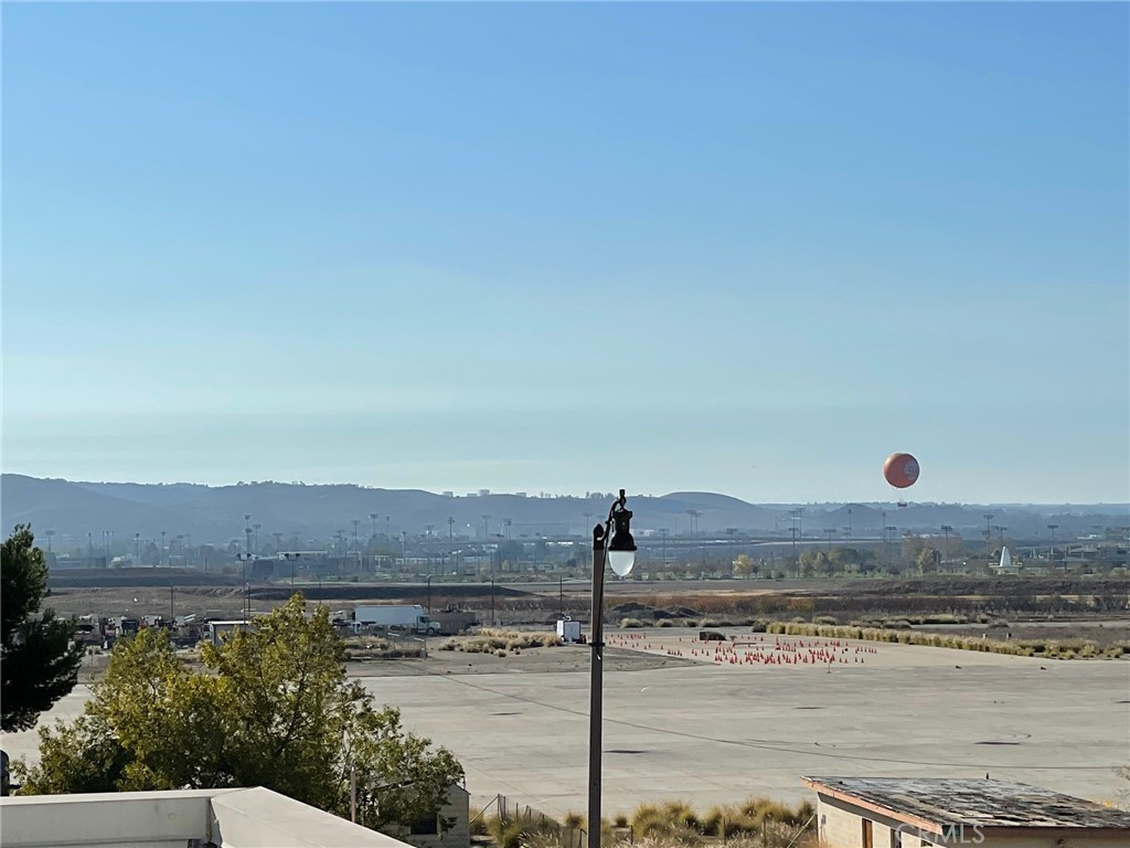 164 Spectacle Irvine, CA 92618 - Photo 20 of 21 a view of a lake with a mountain in the background