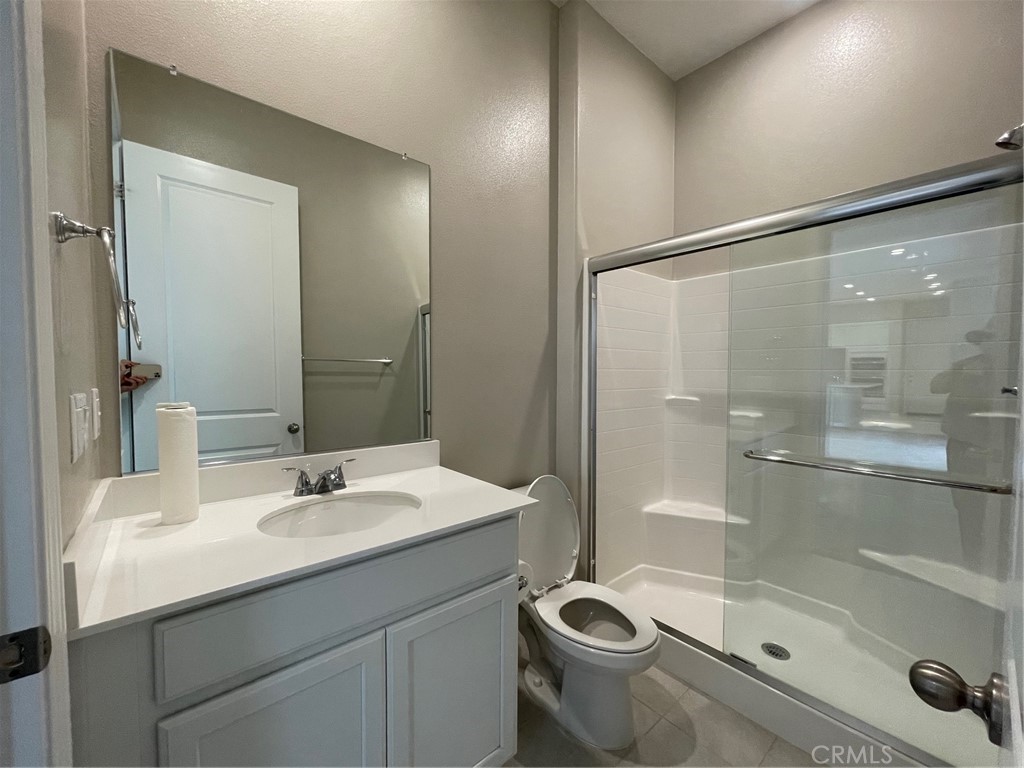 164 Spectacle Irvine, CA 92618 - Photo 7 of 21 a bathroom with a sink mirror toilet and shower