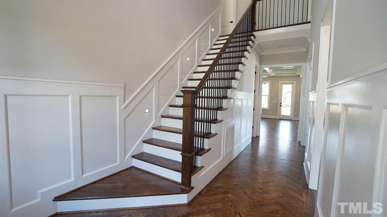 5104 Schellinger Pass Raleigh, NC 27612 - Photo 2 of 30 Hardwoods throughout most of the first floor and custom millwork throughout.