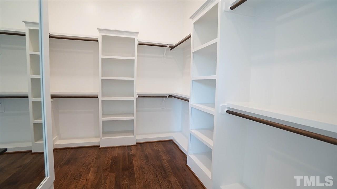 5104 Schellinger Pass Raleigh, NC 27612 - Photo 18 of 30 Plenty of storage space in this walk-in-closet with custom shelving!