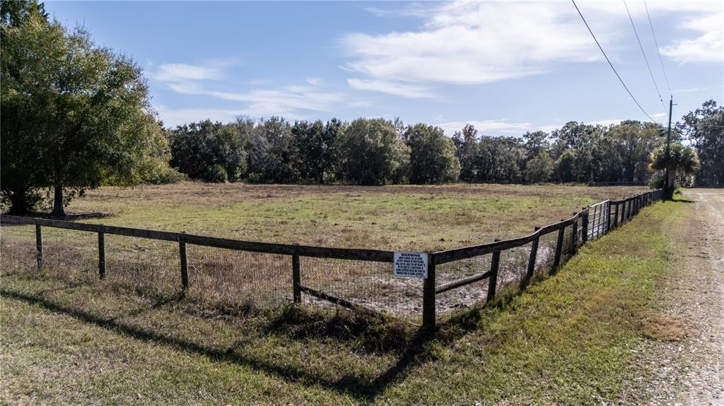 11560 Tarpon Springs Road Odessa, FL 33556 - Photo 16 of 17 a view of a terrace with wooden floor and lake view