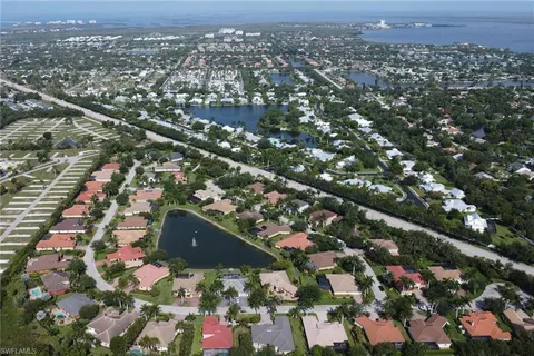 an aerial view of residential houses with city view