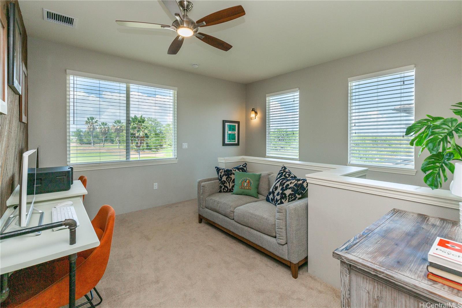 91-1077 Hokua Street Ewa Beach, HI 96706 - Photo 15 of 25 a living room with furniture and a flat screen tv