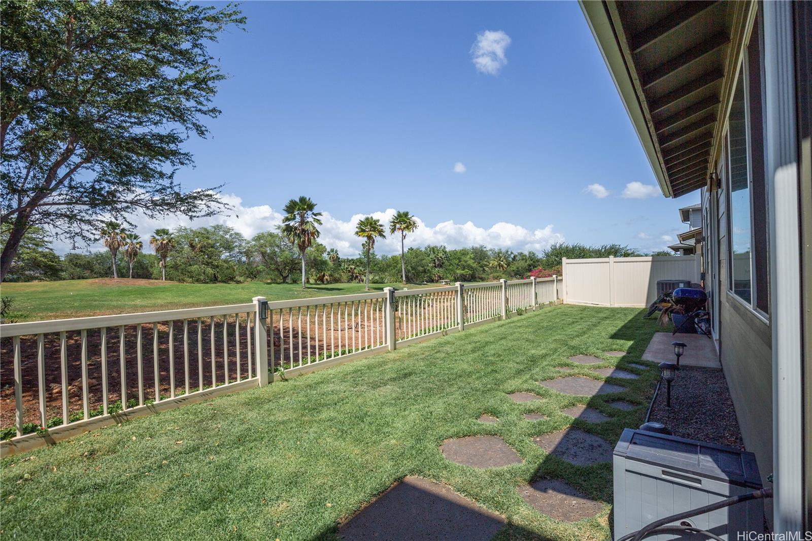 91-1077 Hokua Street Ewa Beach, HI 96706 - Photo 19 of 25 a view of a backyard with wooden fence