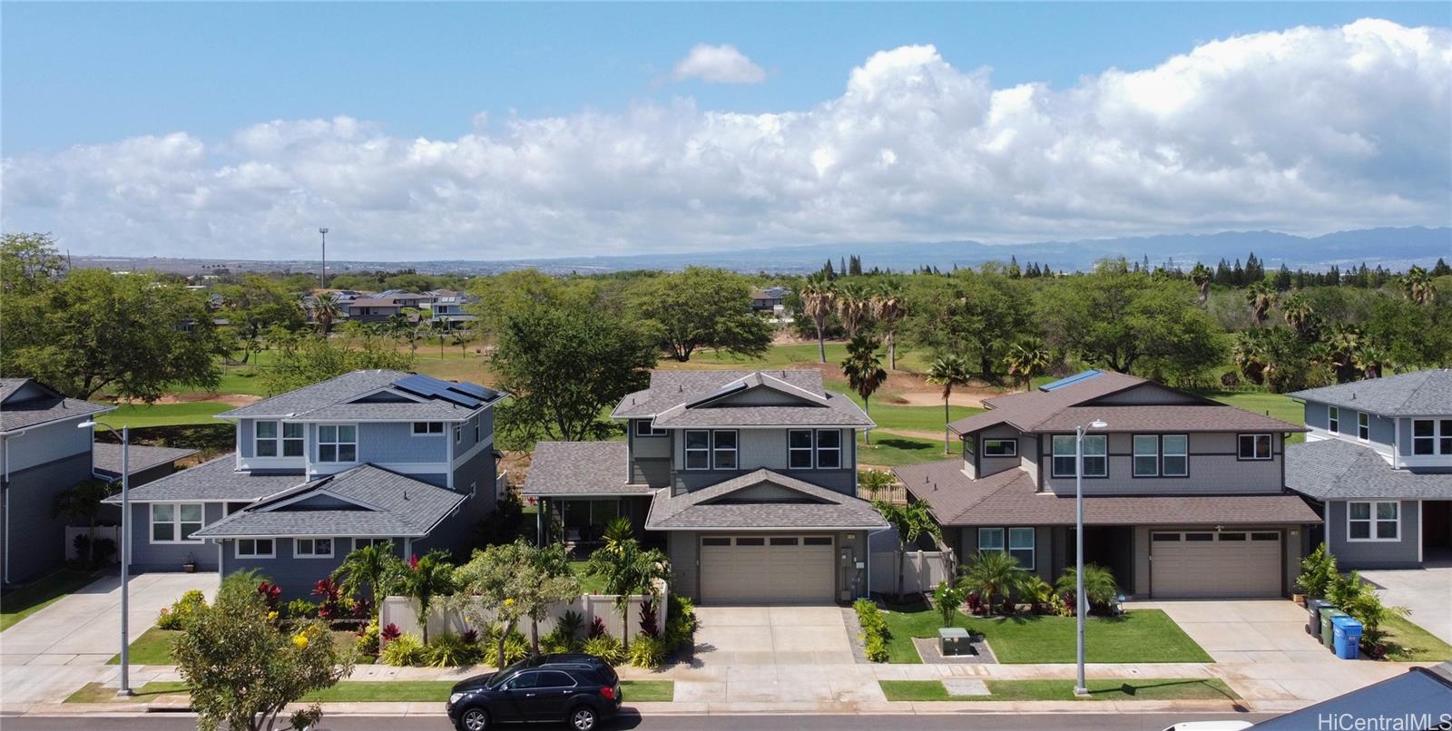 91-1077 Hokua Street Ewa Beach, HI 96706 - Photo 20 of 25 an aerial view of multiple houses with a yard