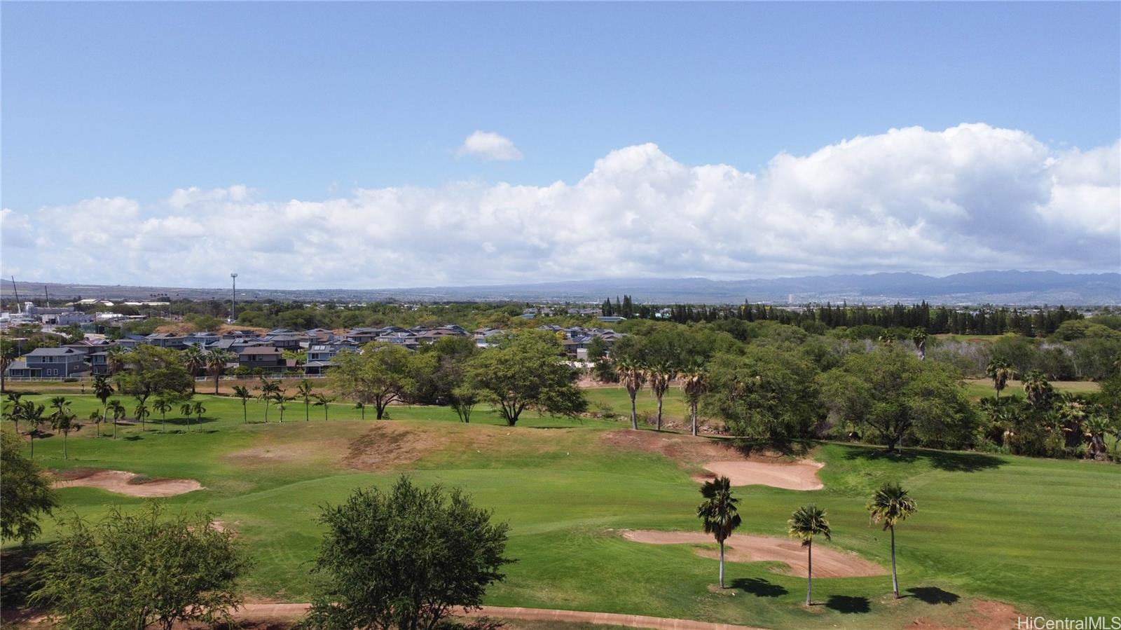 91-1077 Hokua Street Ewa Beach, HI 96706 - Photo 21 of 25 a view of a lake with a yard