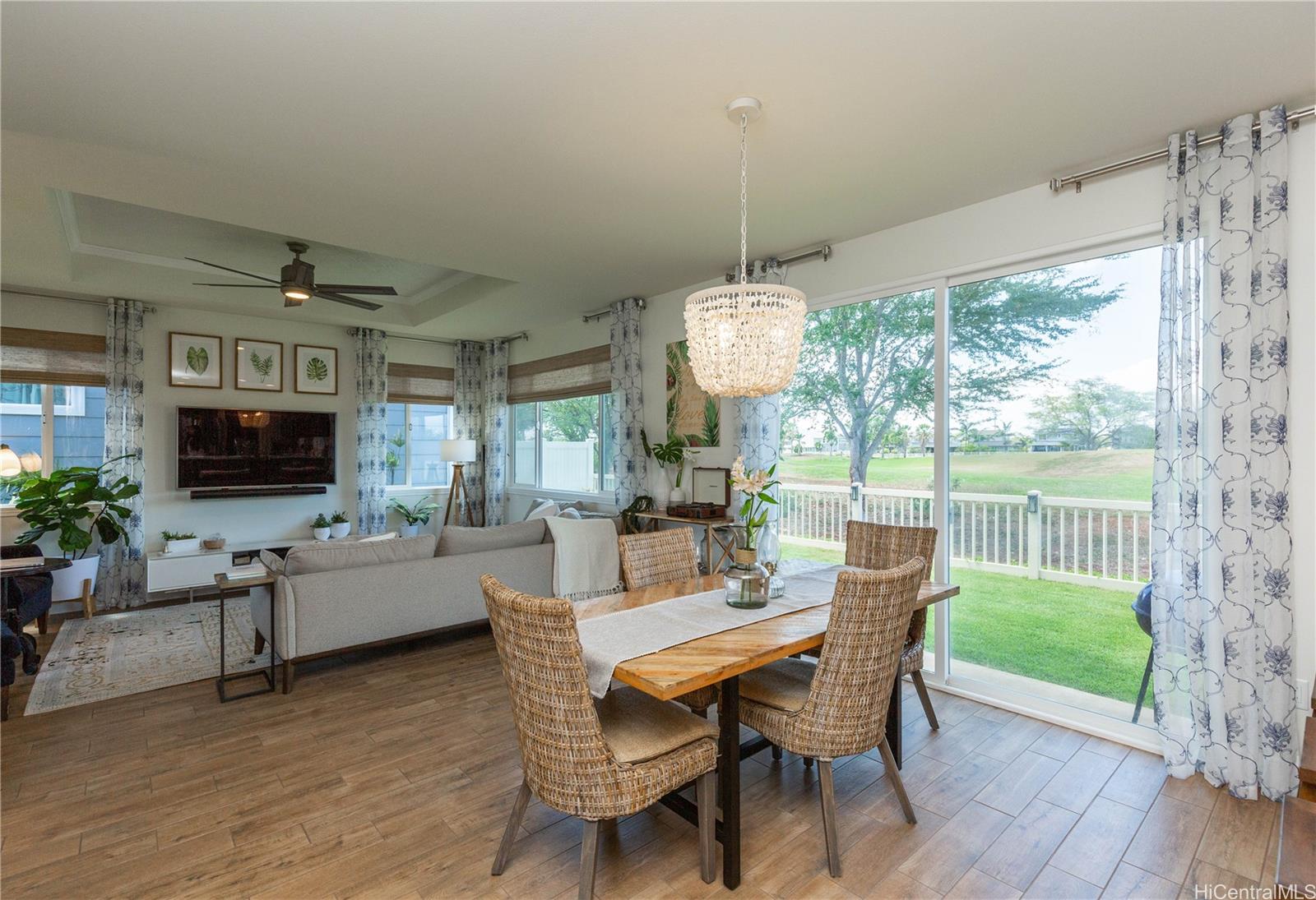 91-1077 Hokua Street Ewa Beach, HI 96706 - Photo 3 of 25 a view of a dining room with furniture window and wooden floor