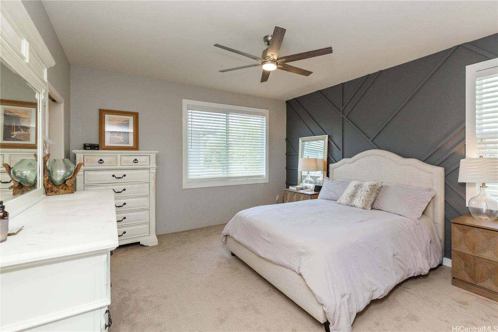 91-1077 Hokua Street Ewa Beach, HI 96706 - Photo 10 of 25 a bedroom with a large bed and a window