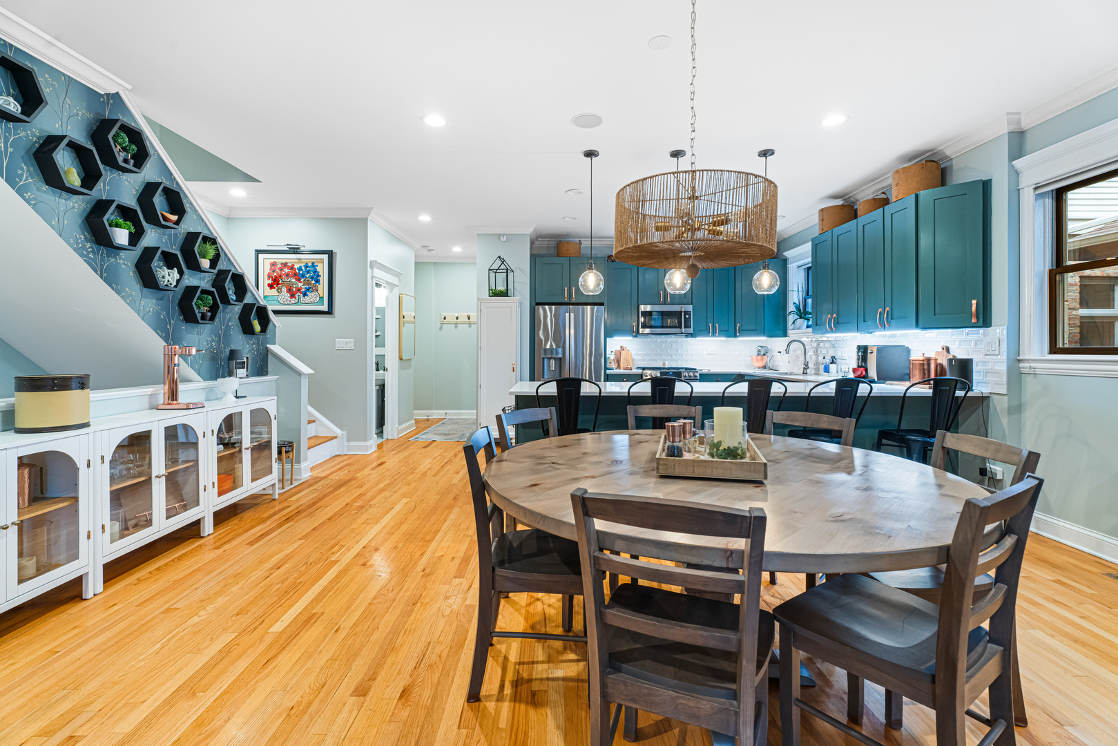 Undisclosed Address Chicago, IL 60613 - Photo 14 of 68 a dining room with stainless steel appliances kitchen island a table and chairs