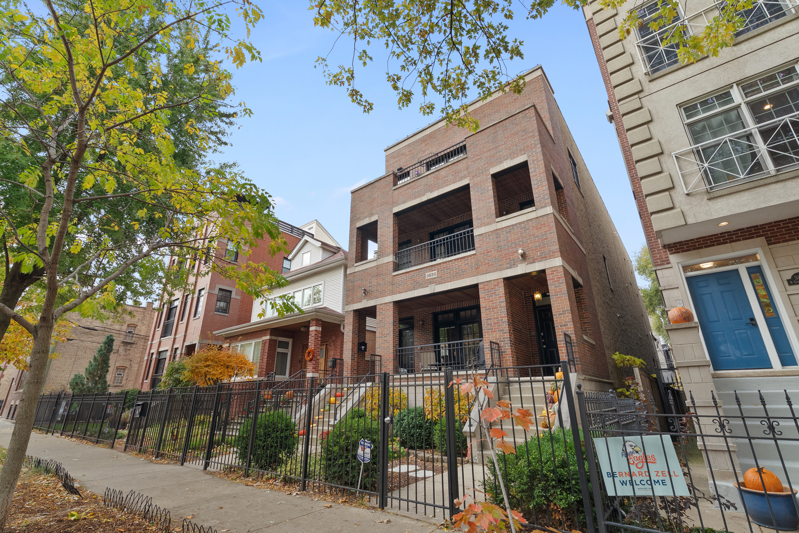 Undisclosed Address Chicago, IL 60613 - Photo 3 of 68 a front view of a multi story building with a yard