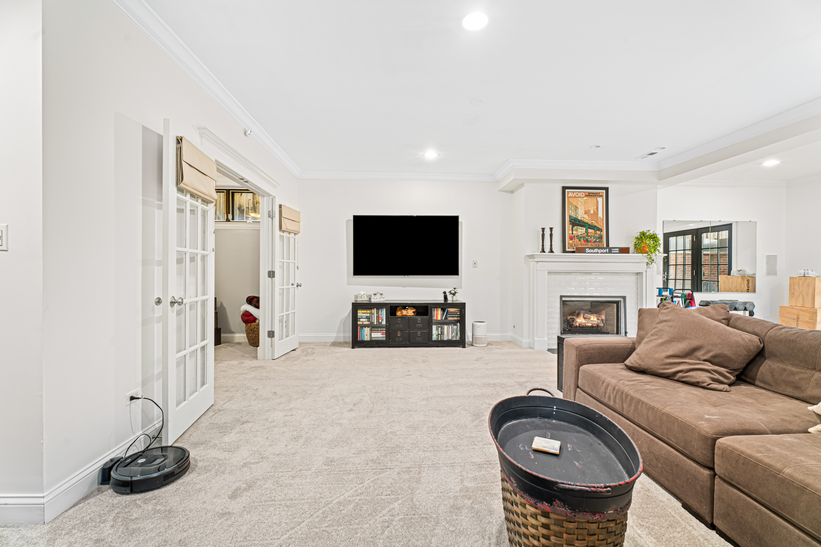 Undisclosed Address Chicago, IL 60613 - Photo 43 of 68 a living room with furniture a flat screen tv and a fireplace