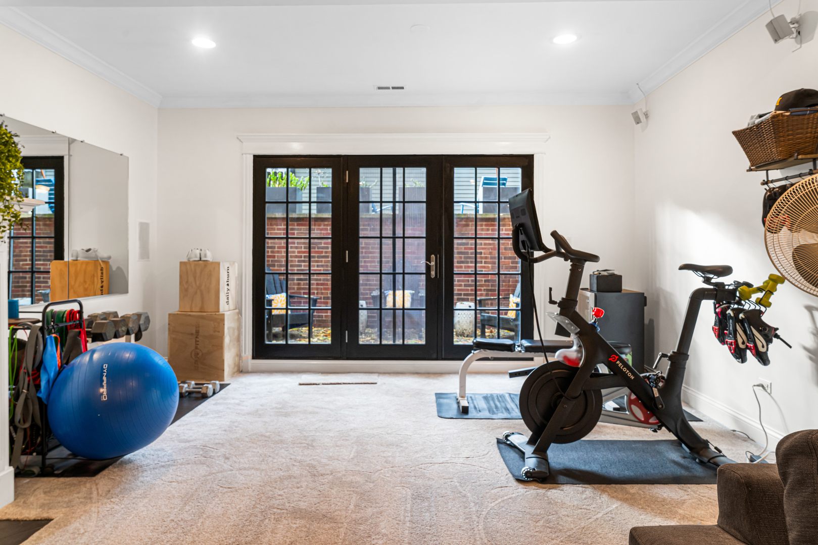 Undisclosed Address Chicago, IL 60613 - Photo 44 of 68 a room with gym equipment and a large window