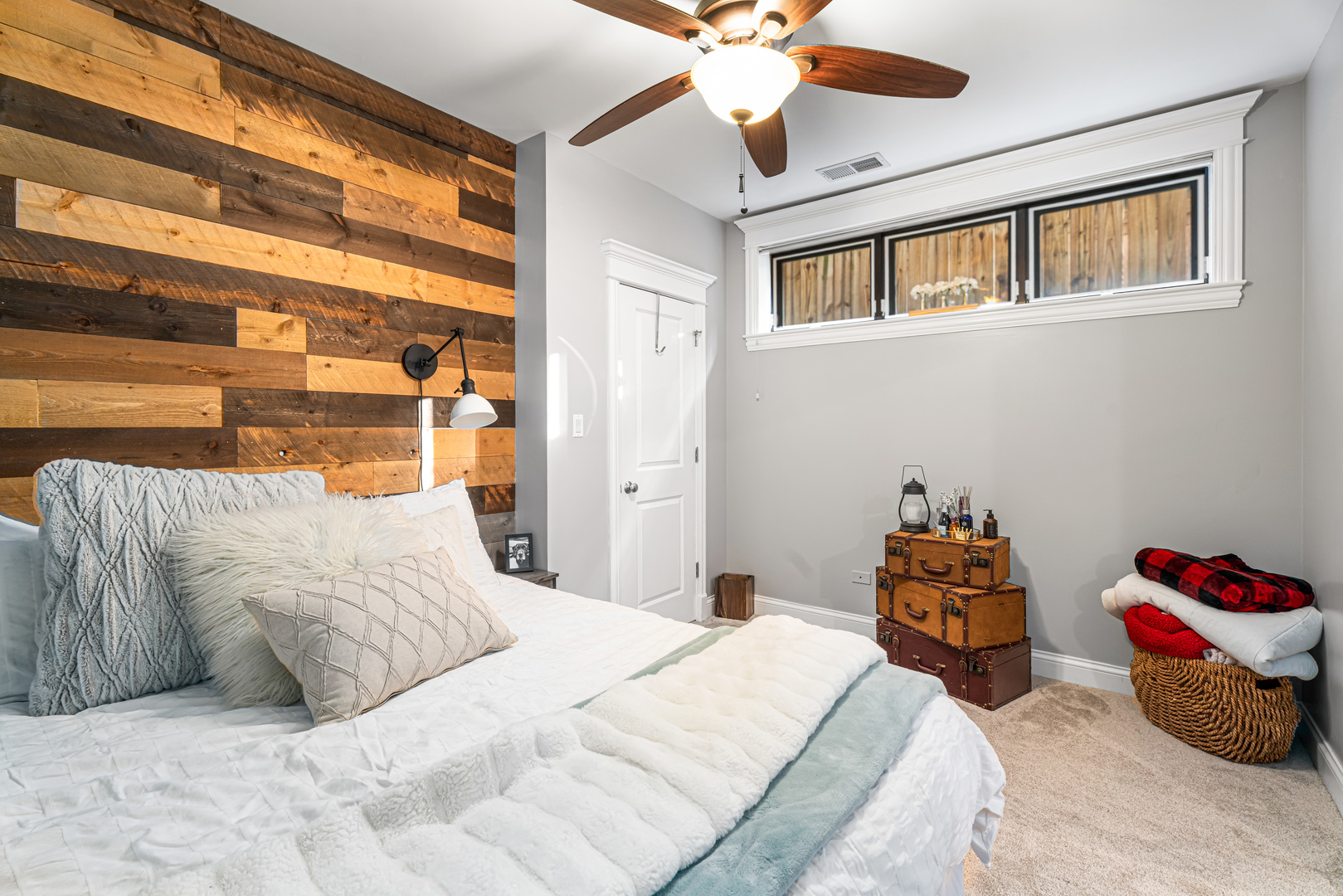 Undisclosed Address Chicago, IL 60613 - Photo 48 of 68 a bedroom with a bed and a chandelier