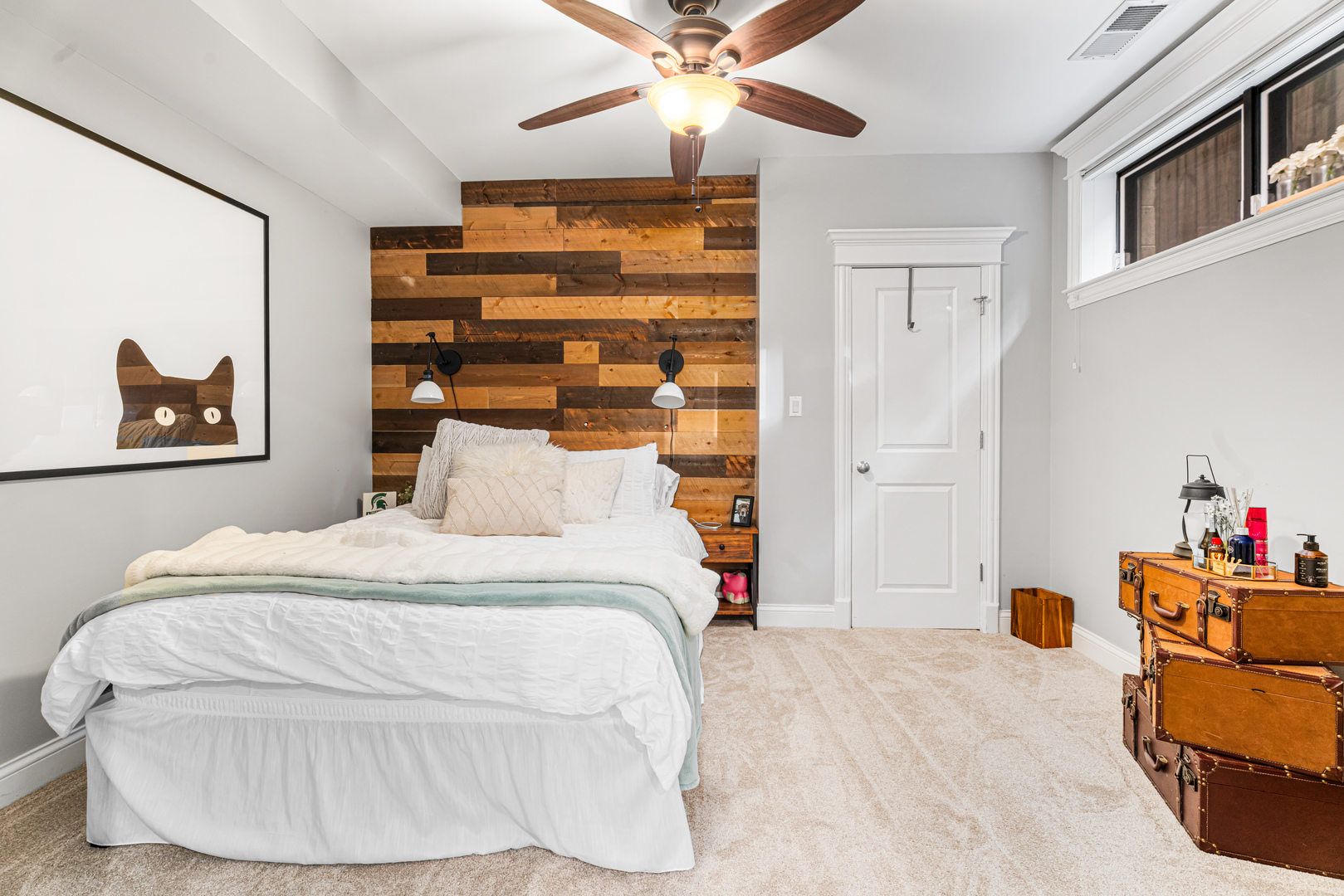 Undisclosed Address Chicago, IL 60613 - Photo 49 of 68 a bedroom with a bed and a chandelier