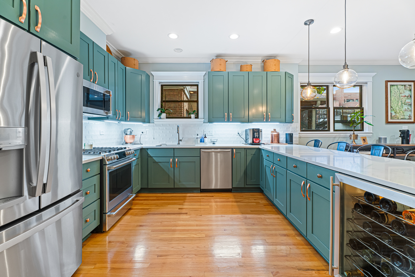 Undisclosed Address Chicago, IL 60613 - Photo 5 of 68 a kitchen with kitchen island a sink a counter top space stainless steel appliances and cabinets