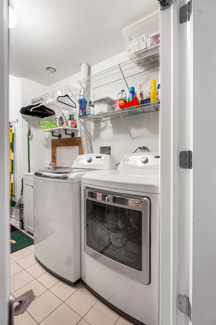 Undisclosed Address Chicago, IL 60613 - Photo 51 of 68 a utility room with washer and dryer