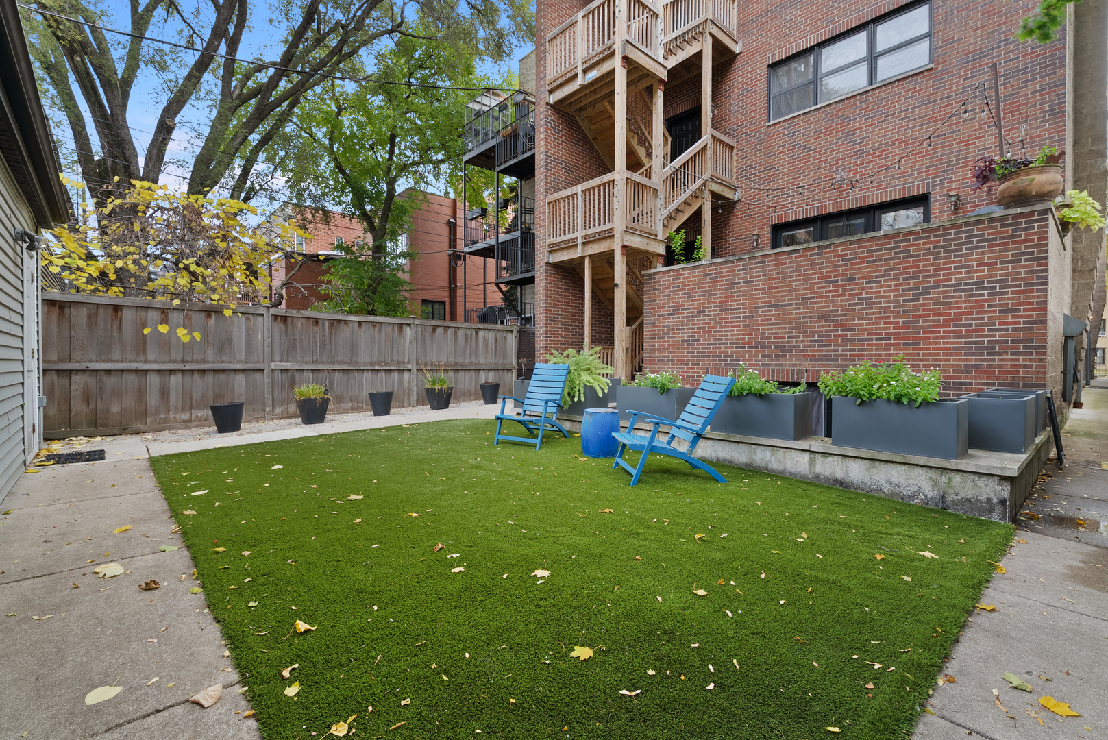 Undisclosed Address Chicago, IL 60613 - Photo 59 of 68 a view of a backyard with a garden