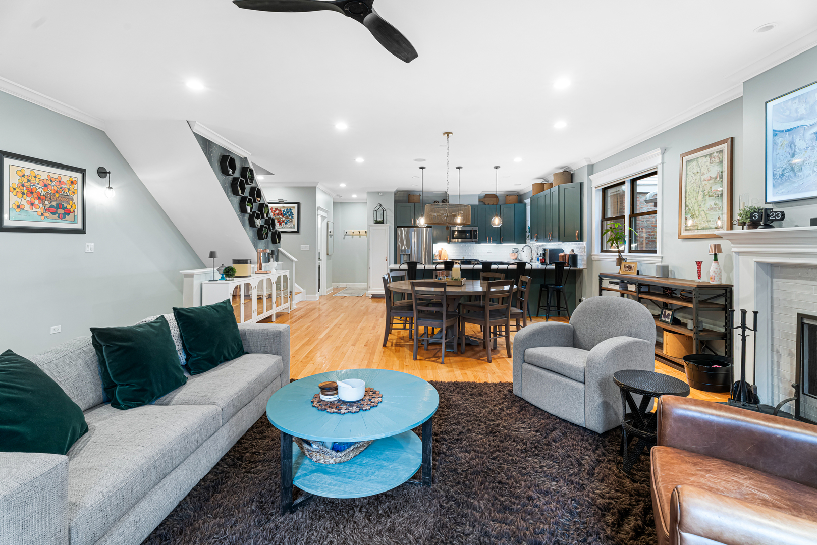 Undisclosed Address Chicago, IL 60613 - Photo 10 of 68 a living room with furniture kitchen view and a fireplace