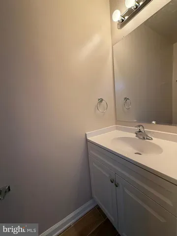 a bathroom with a sink and vanity