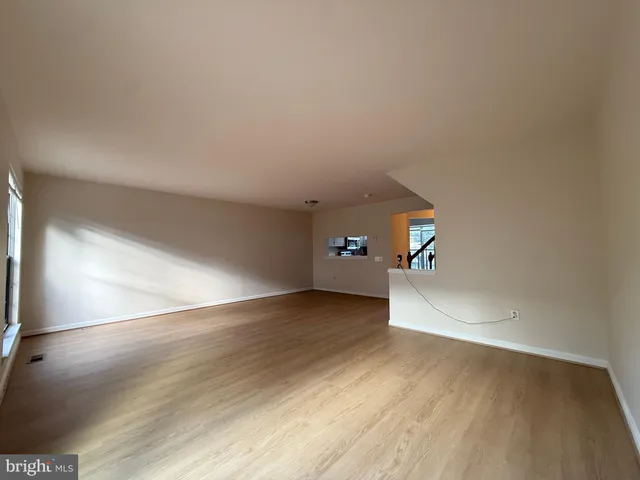 a view of a livingroom with wooden floor