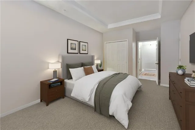 a bathroom with a granite countertop double vanity sink and a mirror