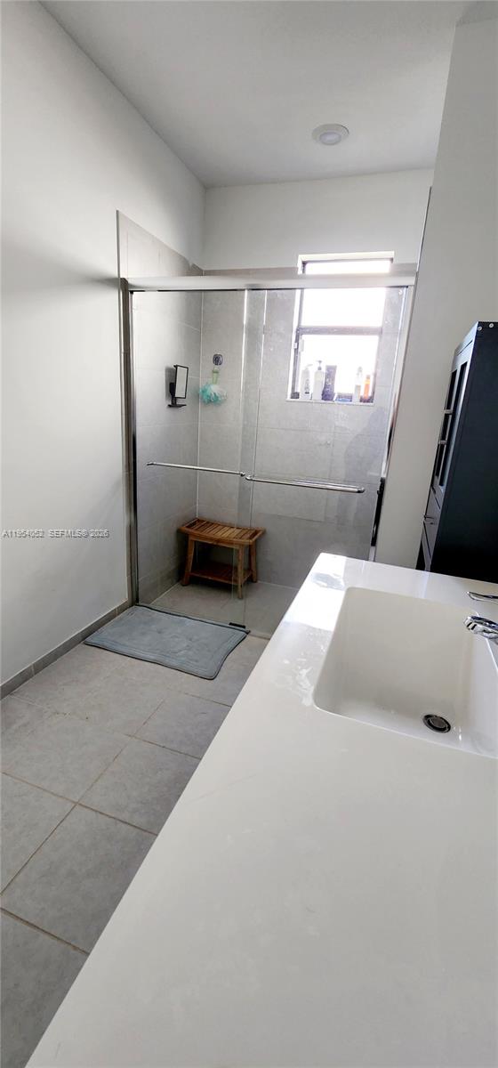 13321 Southwest 284th Street Homestead, FL 33033 - Photo 14 of 30 a bathroom with a tub and a shower