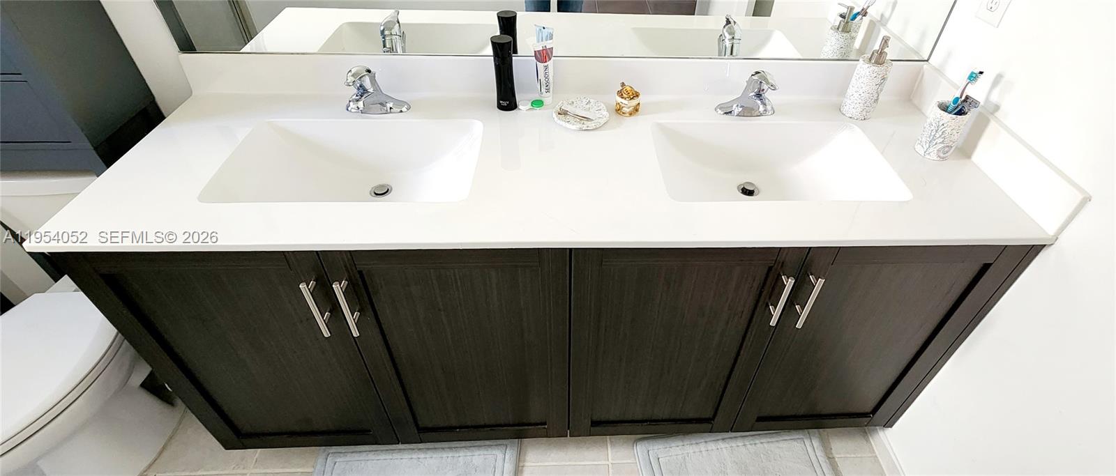13321 Southwest 284th Street Homestead, FL 33033 - Photo 16 of 30 a bathroom with a sink and a mirror