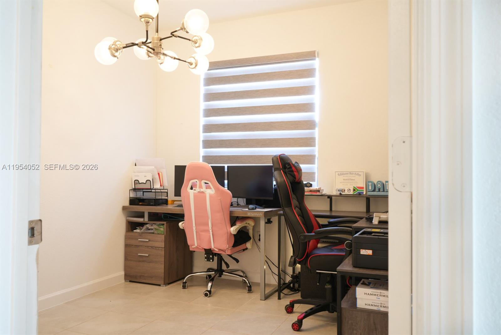 13321 Southwest 284th Street Homestead, FL 33033 - Photo 17 of 30 a view of a workspace with furniture and a window