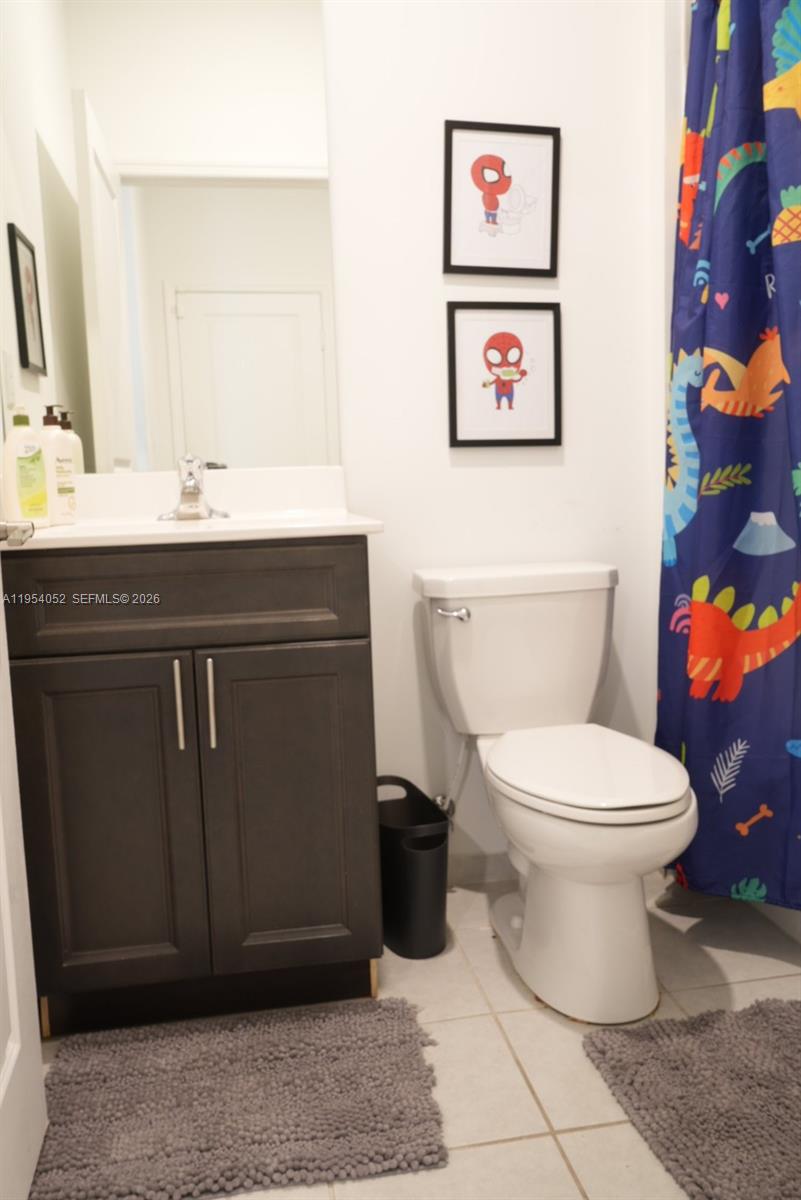 13321 Southwest 284th Street Homestead, FL 33033 - Photo 22 of 30 a bathroom with a toilet and a sink
