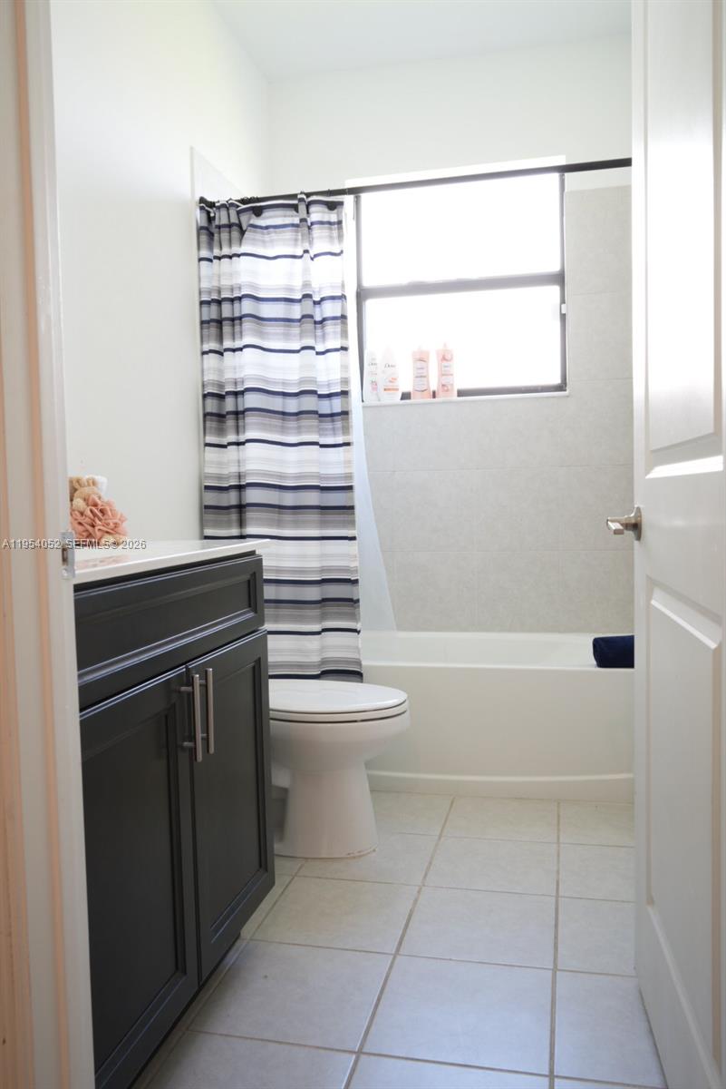 13321 Southwest 284th Street Homestead, FL 33033 - Photo 24 of 30 a bathroom with a sink a toilet and shower