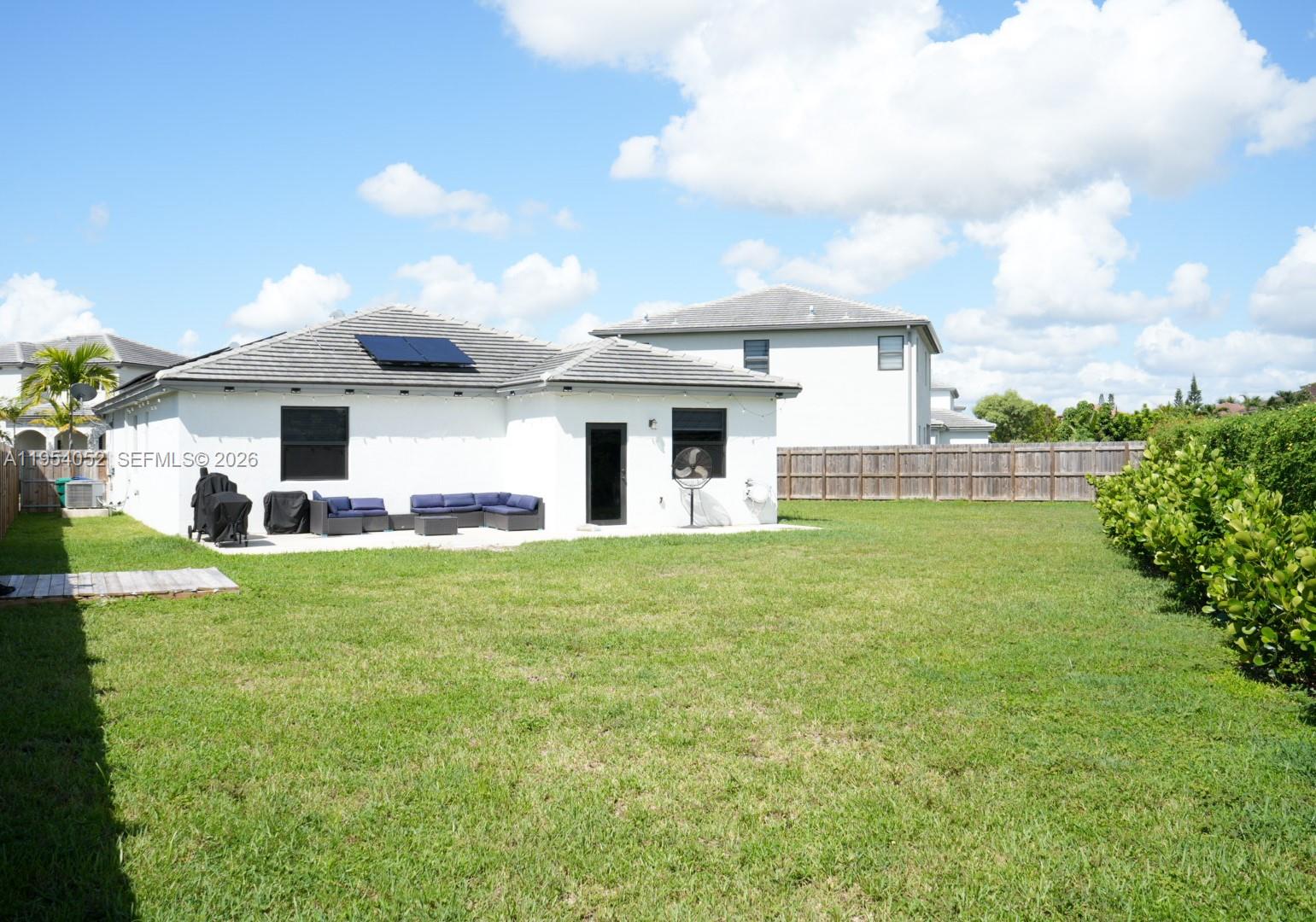13321 Southwest 284th Street Homestead, FL 33033 - Photo 28 of 30 a front view of house with yard and green space