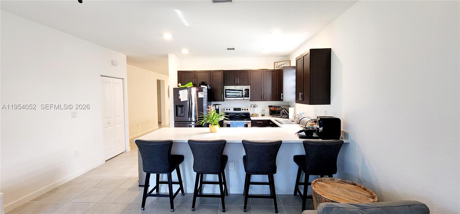 13321 Southwest 284th Street Homestead, FL 33033 - Photo 5 of 30 a view of a dining room with furniture
