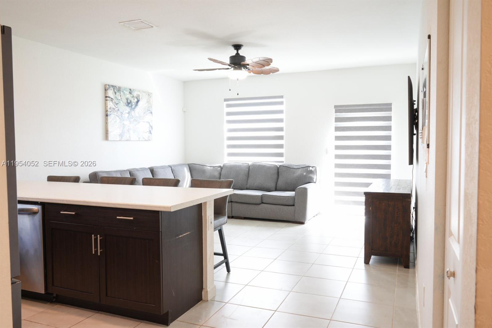 13321 Southwest 284th Street Homestead, FL 33033 - Photo 8 of 30 a kitchen with a sink and a stove top oven