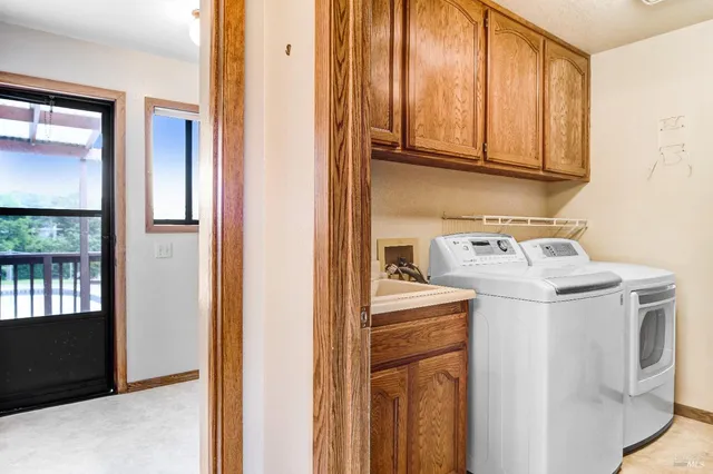 a utility room with closet dryer and washer