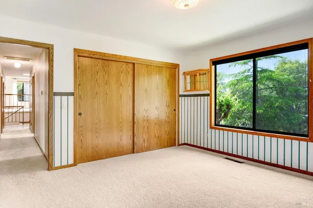 a view of a room with a large window