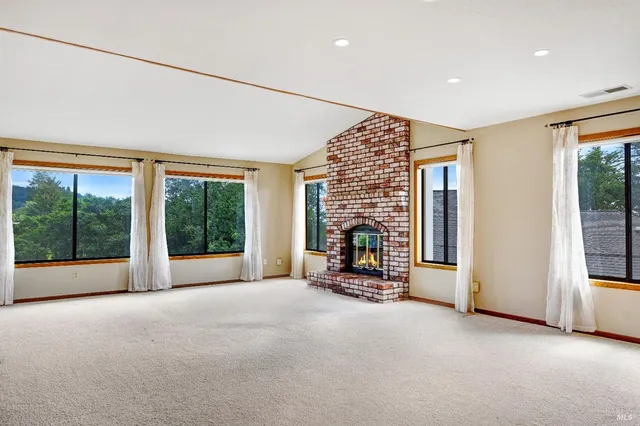 a view of empty room with floor to ceiling window