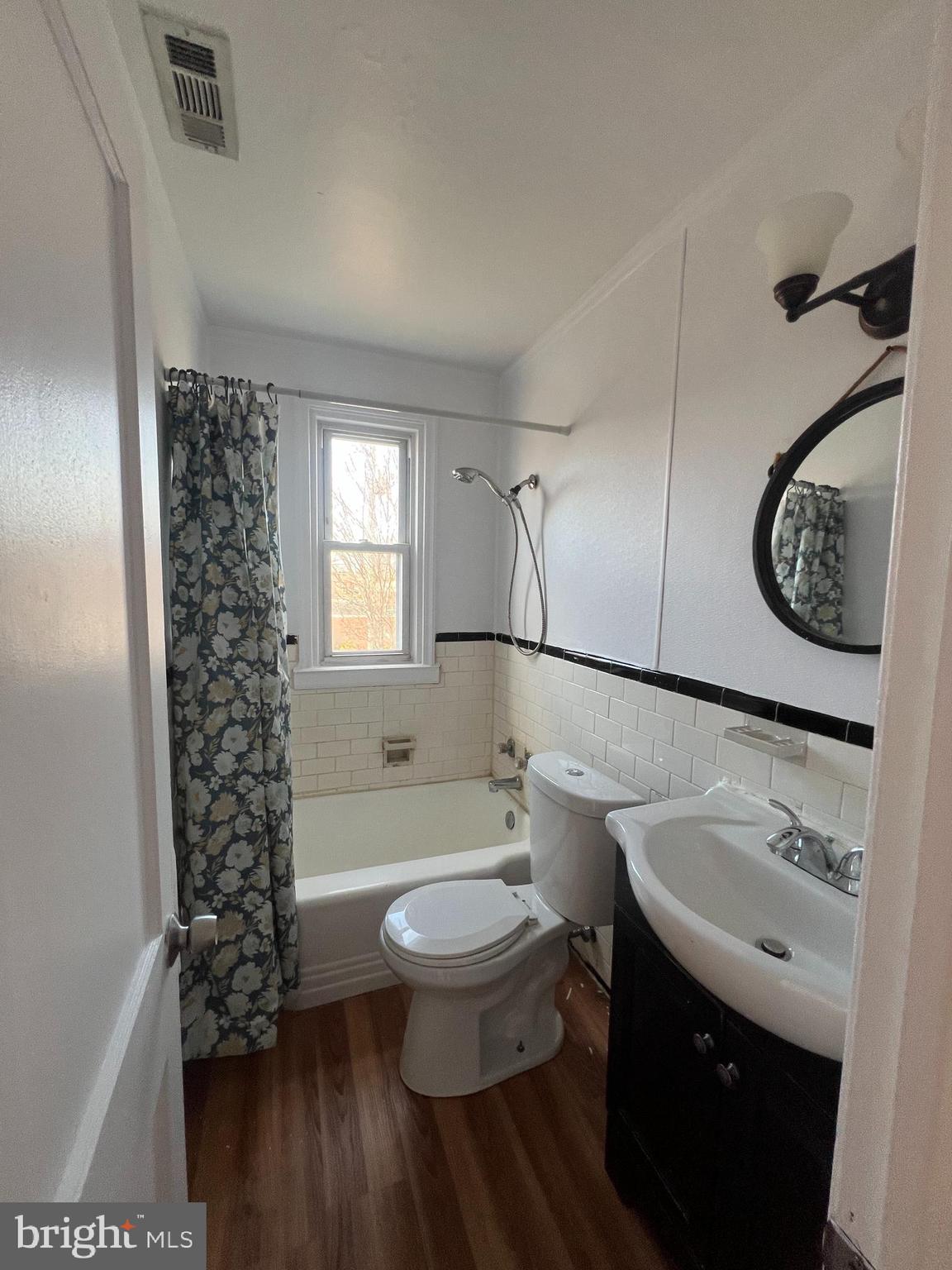 2900 Cornwall Road Baltimore, MD 21222 - Photo 13 of 17 a bathroom with a sink toilet and shower